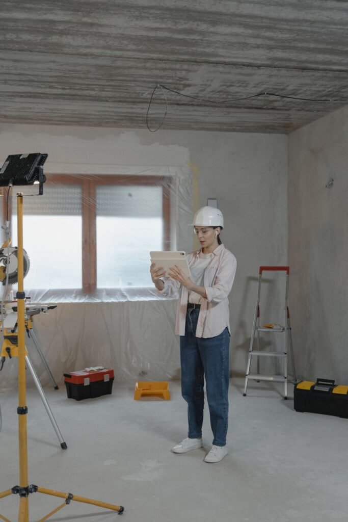 Contractor reviewing contractor website design leads on a tablet at a job site